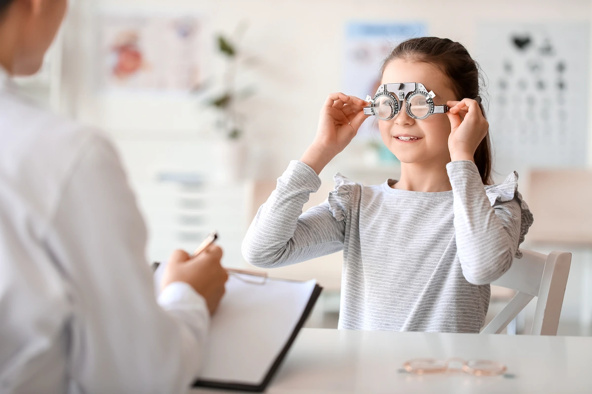 myopia_exam Girl undergoing eye test in optometry office